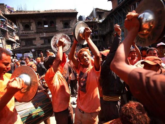 Nepalese youths play traditional music during The Bisket Jatra Festival at Thimi on the outskirts of Kathmandu. The traditional Bisket Jatra festival is celebrated during the Nepali New Year. AFP PHOTO/ Prakash MATHEMA