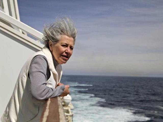 Helen Edwards, 62, from Silver Spring, Md., reflects as the MS Balmoral Titanic memorial cruise ship approaches the wreck site of the Titanic in the Atlantic Ocean. (AP/Lefteris Pitarakis)