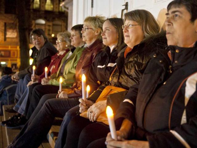 People gather at Halifax remember Titanic sinking with funeral procession, song and performance Night of the Bells event in the Grand Parade square to mark the sinking of the RMS Titanic. (AFP/Rogerio Barbosa)