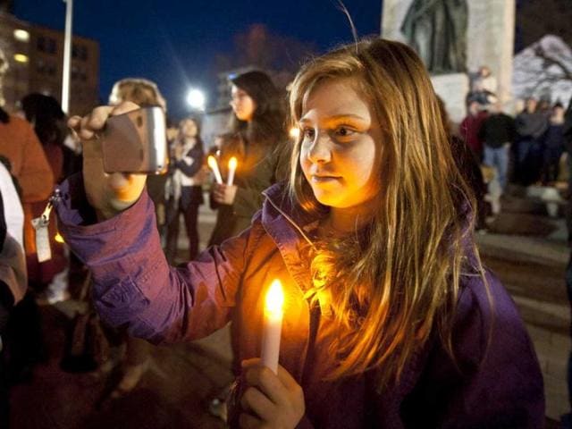 People gather at Halifax remember Titanic sinking with funeral procession, song and performance Night of the Bells event in the Grand Parade square to mark the sinking of the RMS Titanic. (AFP/Rogerio Barbosa)