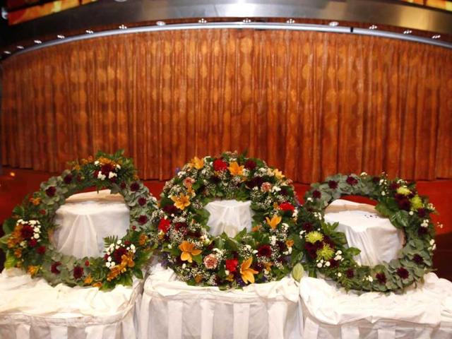 Three wreaths are seen before a memorial service on board the MS Balmoral in the western Atlantic Ocean. Reuters/Chris Helgren