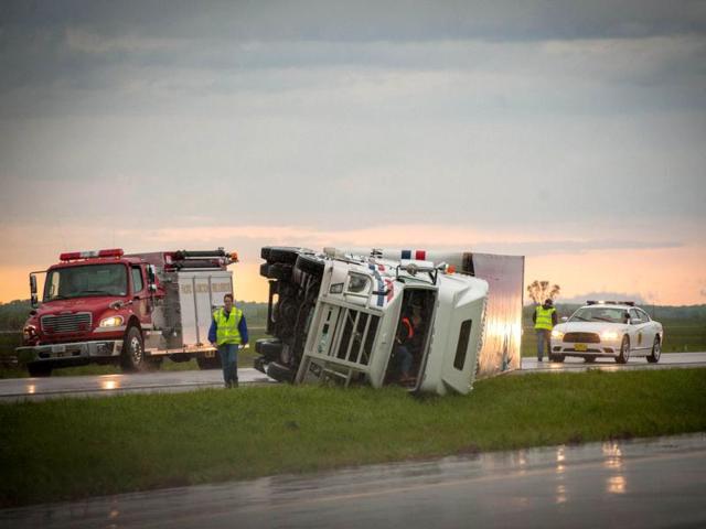 Several Semi trucks and their trailers are overturned on Interstate 29 in Thurman, Iowa. The storms were part of a massive system that affected areas from Northern Nebraska south through Oklahoma. Eric Francis/Getty Images/AFP