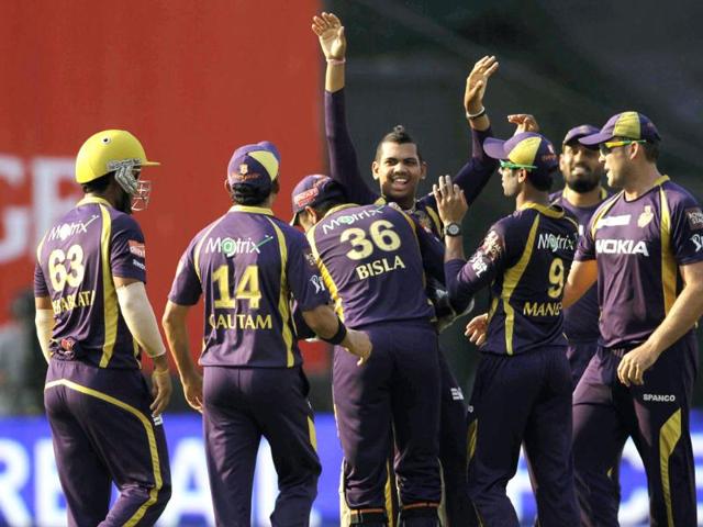 Sunil Narine, center, of Kolkata Knight Riders celebrates with teammates the dismissal of Shaun Marsh of Kings XI Punjab during their IPL cricket match in Kolkata. AP/Bikas Das