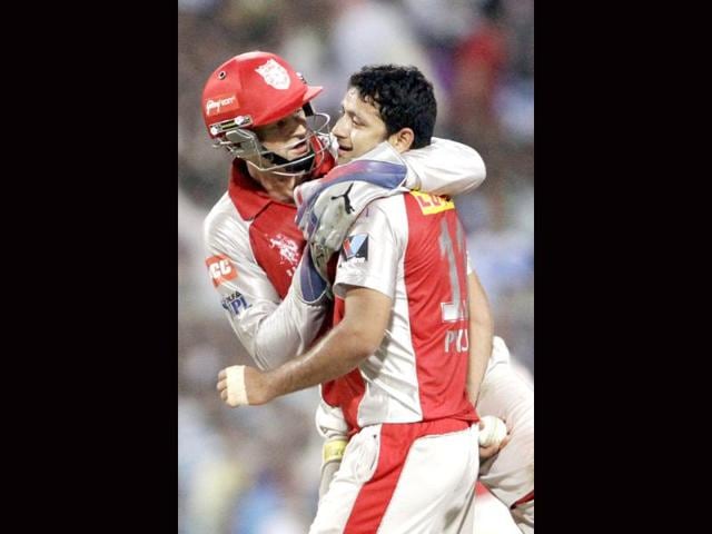 Piyush Chawla, right, of Kings XI Punjab reacts as he celebrates with teammate Adam Gilchrist the dismissal of Manvinder Bisla of Kolkata Knight Riders during their Indian Premier League (IPL) match in Kolkata. AP/Bikas Das