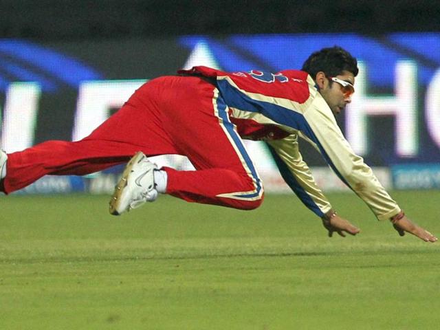 Royal Challengers Bangalore's Virat Kohli drops down to field the ball during the IPL 5 match against Rajasthan Royals at Chinnaswamy stadium in Bengaluru. PTI/Shailendra Bhojak