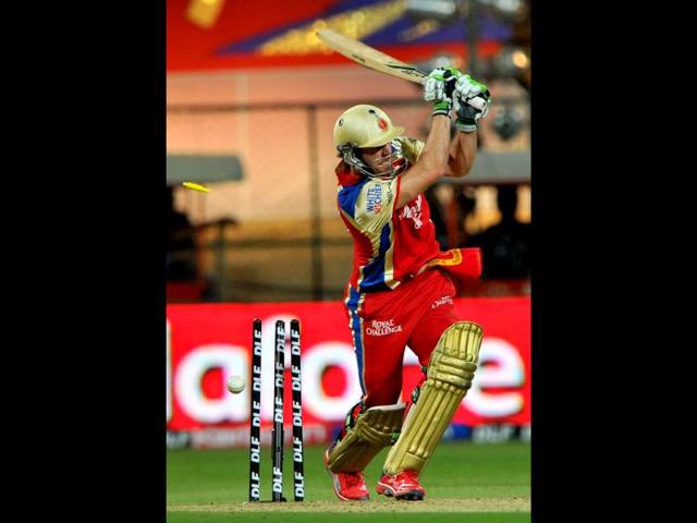 Royal Challengers Bangalore batsman AB deVilliers loses his wicket to Rajasthan Royals bowler Siddharth Trivedi during the IPL Twenty20 cricket match at the M Chinnaswamy Stadium in Bangalore. AFP/Manjunath Kiran