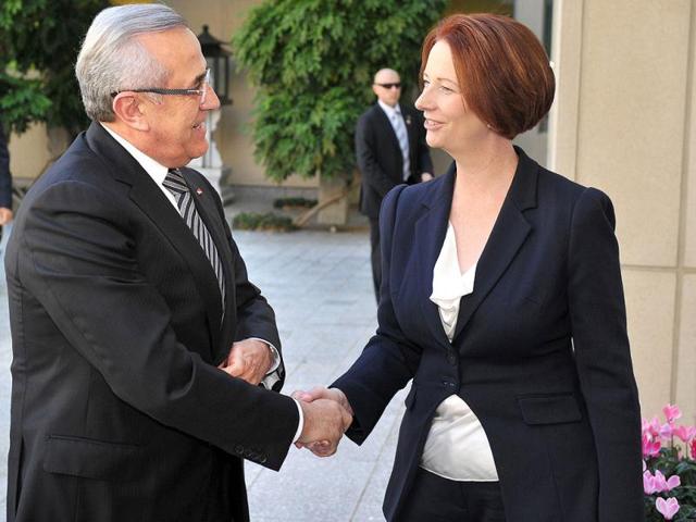 Lebanon's President Michel Suleiman is welcomed by Australian Prime Minister Julia Gillard at Parliament House in Canberra, Australia. (AP Photo/Mark Graham)