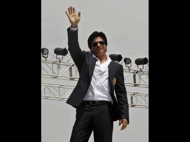 The star waves to his fans.