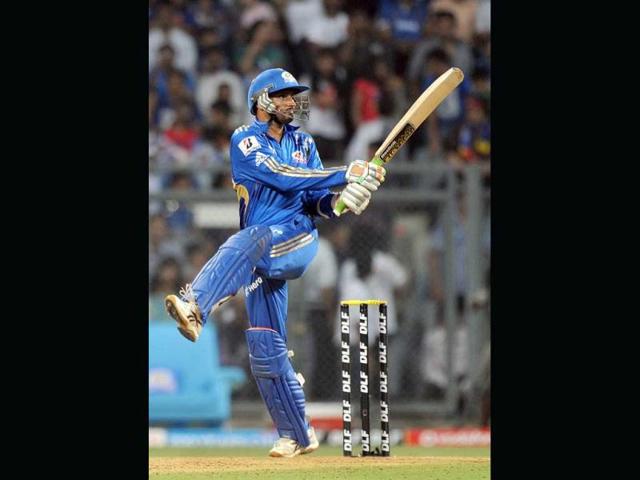 Mumbai Indians captain Harbhajan Singh plays a shot during the IPL Twenty20 cricket match between Mumbai Indians and Delhi Daredevils at the Wankhede Stadium in Mumbai. AFP Photo/Punit Paranjpe