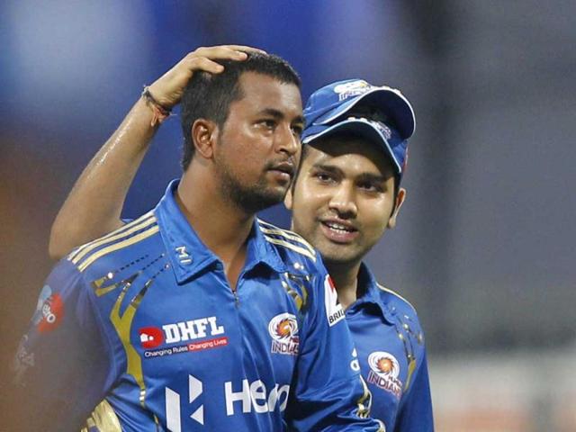 Mumbai Indians Pragyan Ojha and Rohit Sharma celebrate the Delhi Daredevils Virender Sehwags wicket during the IPL T20 match between Mumbai Indians vs Delhi Daredevils at Wankhede Stadium in Mumbai. HT Photo/Sattish Bate