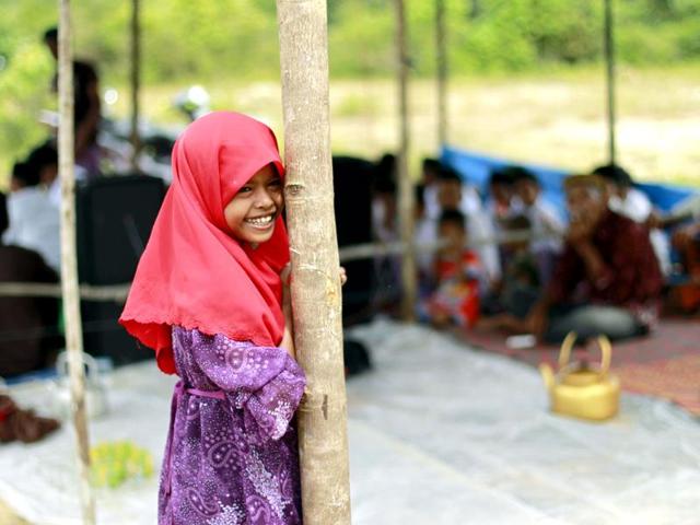 An Acehnese girl attends celebrations of Maulidin Nabi or the birth of Prophet Muhammad in Calang.(Reuters/Beawiharta)