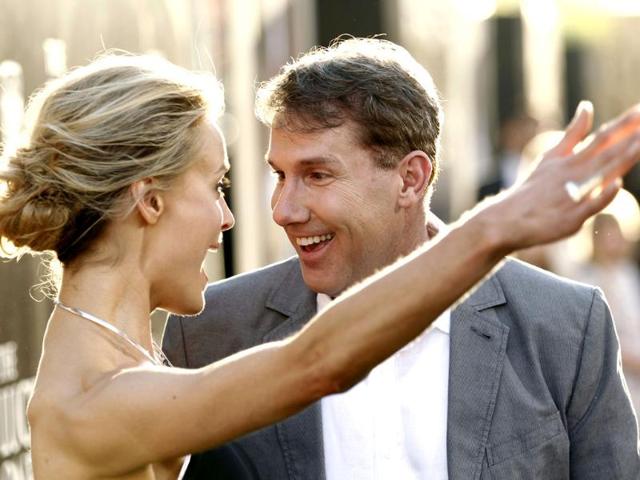 Author Nicholas Sparks, right, and cast member Taylor Schilling greet each other at the premiere of "The Lucky One" in Los Angeles. (AP Photo/Matt Sayles)
