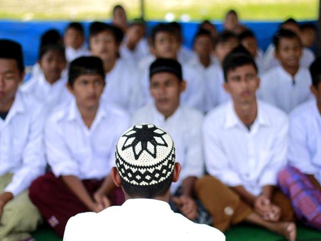 Acehnese youth sing an Islamic song as celebration of Maulidin Nabi or the birth of Prophet Muhammad in Calang. (Reuters/Beawiharta)