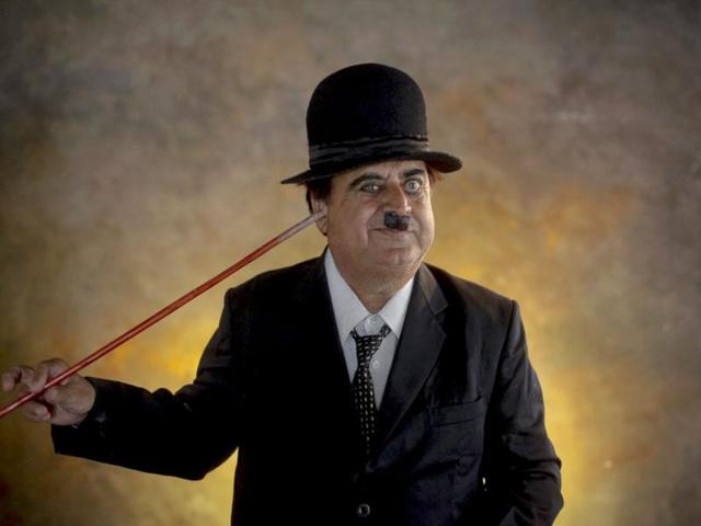Ashok Aswani dressed up as Charlie Chaplin, poses inside a studio in Adipur in Gujarat. Aswani who is an Ayurvedic doctor, sometimes gives away free Chaplin CDs with his potions to cheer his patients up. (Reuters/Danish Siddiqui)