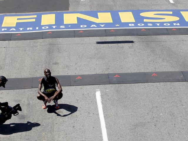 Wesley Korir, of Kenya, smiles after crossing the finish line to win the 116th Boston Marathon in Boston, Massachusetts. (Reuters/Jessica Rinaldi)