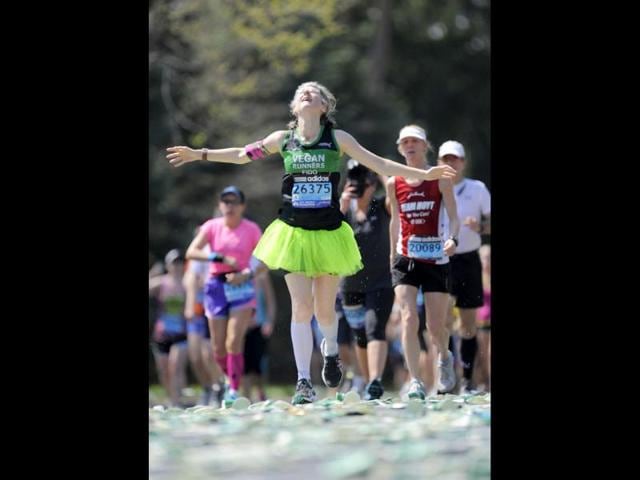 A runner looks up to the sky along the route of the 116th Boston Marathon in Wellesley, Massachusetts. (Reuters/Gretchen Ertl)