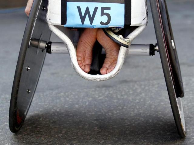 The feet of Joshua Cassidy of Canada are tucked into his wheelchair after he won the men's wheelchair division of the 116th Boston Marathon in Boston, Massachusetts. (Reuters/Brian Snyder)