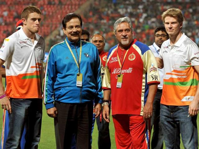 (L-R) Sahara Force India driver Paul di Resta, owner of Sahara Group of companies, Sahara Force India formula car racing team and Pune Warriors team Subroto Roy Sahara, UB Group chairman and owner of RCB team Vijay Mallya and Sahara Force India driver Nico Hulkenberg pose for a photograph prior to the IPL Twenty20 cricket match between Royal Challengers Bangalore and Pune Warriors at the M Chinnaswamy Stadium in Bangalore. AFP/Manjunath Kiran