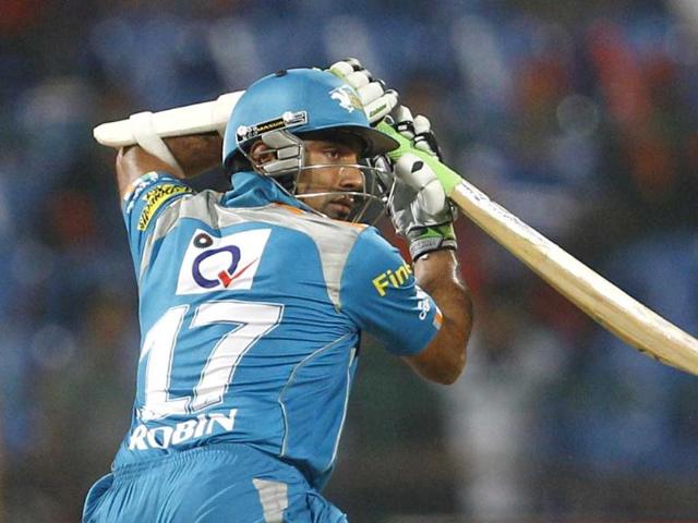 Pune Warriors batsman Robin Uthappa watches his shot during their Indian Premier League (IPL) cricket match against Royal Challengers Bangalore in Bangalore. AP/Aijaz Rahi