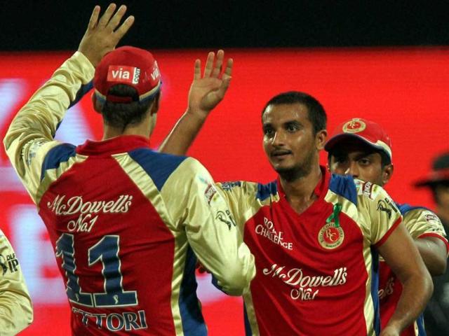 Royal Challengers Bangalore's Harshal Patel celebrates with team mates the wicket of Pune Warriors' Jesse Ryder during an IPL 5 match at Chinnaswamy stadium in Bengaluru. PTI/Shailendra Bhojak