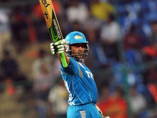 Pune Warriors batsman Robin Uthappa raises his bat after scoring 50 runs during the IPL Twenty20 cricket match against Royal Challengers Bangalore at the M Chinnaswamy Stadium in Bangalore. AFP/Manjunath Kiran