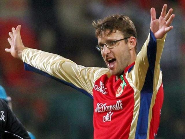 Royal Challengers Bangalore skipper Daniel Vettori celebrates the wicket of Pune Warriors' Robin Uthappa during the IPL 5 match at Chinnaswamy stadium in Bengaluru. PTI/Shailendra Bhojak