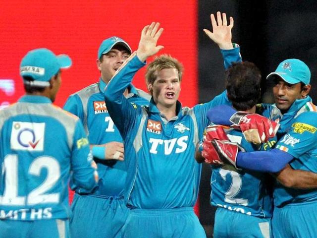 Pune Warriors cricketers celebrate after taking the wicket of T Dilshan of Royal Challengers Bangalore during the IPL 5 match in Bengaluru. PTI/Shailendra Bhojak