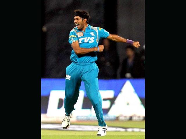 Pune Warriors bowler Ashok Dinda celebrates the wicket of T Dilshan of Royal Challengers Bangalore during an IPL 5 match in Bengaluru. PTI/Shailendra Bhojak