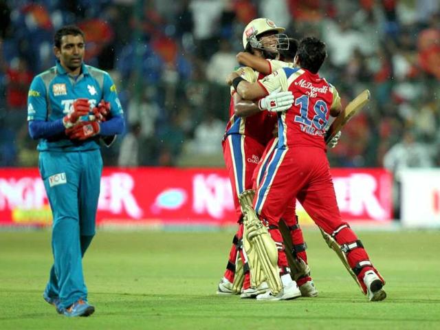 Royal Challengers Bangalore players celebrate after beating Pune Warriors in an IPL 5 match in Bengaluru. PTI/Shailendra Bhojak