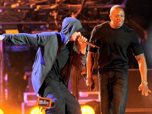 Eminem, left, performs with Dr. Dre during the headlining performance by Dre and Snoop Dogg on the first weekend of the 2012 Coachella Valley Music and Arts Festival in Indio, Calif. (AP Photo/Chris Pizzello)