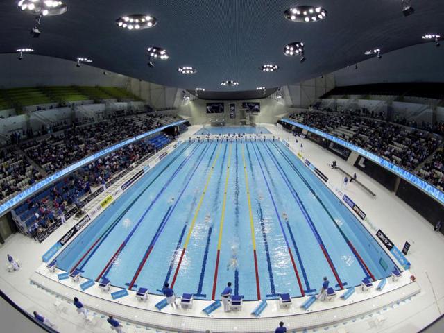 This photo shows swimmers competing in the men's 1500 meter freestyle during the British Swimming Championship selection trials and Olympic test event at the London 2012 Olympic Aquatics Centre at the Olympic Park in London. (AP Photo/Sang Tan, File)