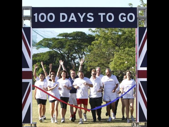British and Filipino embassy staff, led by British Ambassador to the Philippines Stephen Lillie, third from right, front row, make the ceremonial 100m race to mark the 100 days countdown to the 2012 London Olympics. (AP Photo/Bullit Marquez)