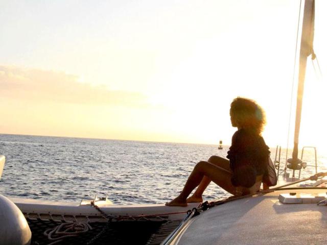 She looks out on to the ocean in the distance.