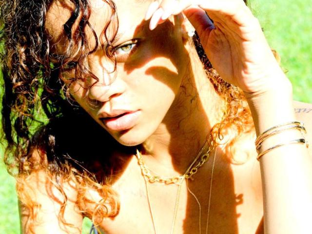 Rihanna protects her face from the sun.