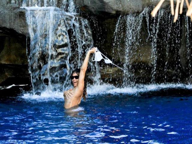Rihanna has posted risqué pictures on Facebook from her wild holiday in Hawaii, including one where she goes topless while bathing under a waterfall. Here's a look at her best 50 snaps from the vacation.
