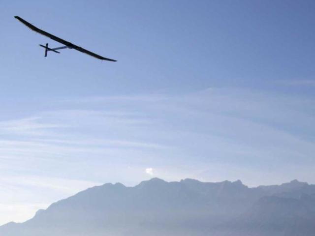 Solar Impulse's CEO and pilot Andre Borschberg flies in the solar-powered HB-SIA prototype airplane above Lake Leman near Vevey during a test flight from its base in Payerne to Geneva International airport. Reuters/Denis Balibouse
