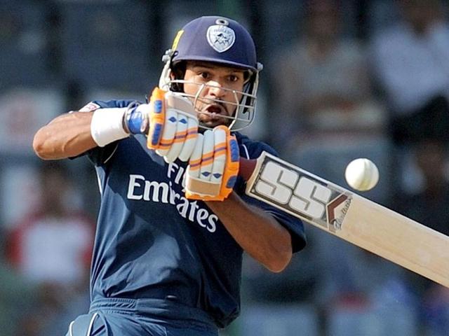 Deccan Chargers batsman Shikhar Dhawan hits a boundary during the IPL-5 match between Deccan Chargers and Delhi Daredevils at Ferozshah Kotla stadium in New Delhi. AFP Photo/Manan Vatsyayana