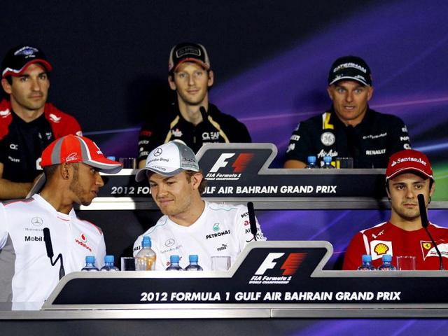 From top left, Marussia driver Timo Glock of Germany, Lotus driver Romain Grosjean of France, Caterham driver Heikki Kovalainen of Finland, and on left down McLaren Mercedes driver Lewis Hamilton of Britain, Mercedes Grand Prix driver Nico Rosberg of Germany and Ferrari driver Felipe Massa of Brazil attend a news conference ahead the Bahrain Formula One Grand Prix at the Formula One Bahrain International Circuit in Sakhir, Bahrain. AP/Luca Bruno