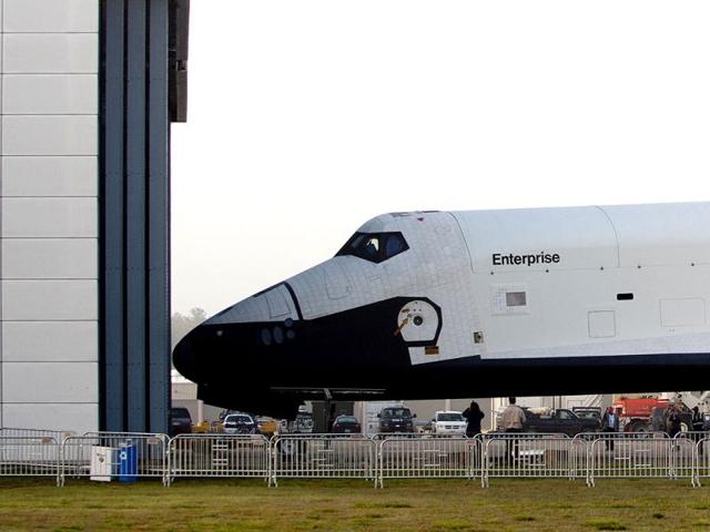 The Space Shuttle Enterprise moves out of the Space hangar at the Smithsonian National Air and Space Museum Steven F Udvar-Hazy Center in Chantilly, Virginia. (AFP Photo)
