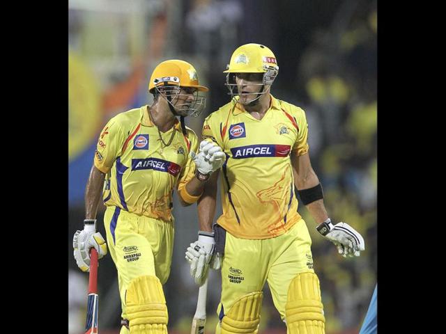 Chennai Super Kings batsmen Subramaniam Badrinath (L) and Faf du Plessis interact during the IPL Twenty20 cricket match. (AFP Photo/Seshadri Sukumar)