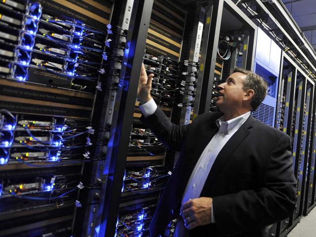 Tom Furlong, Vice President of Site Operations at Facebook, points out servers during a tour of the new Facebook Data Center in Forest City, North Carolina. (AFP/Rainier Ehrhardt)