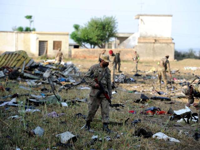 Debris of the crashed Bhoja Air flight B4-213 scattered over an area of over one kilometre and parts of the aircraft fell on some houses in the village. AFP Photo/Aamir Qureshi