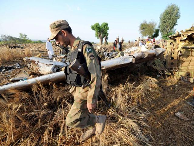 Pakistani soldiers and rescue workers search through debris in Hussain Abad after a Bhoja Air Boeing 737 plane crashed on the outskirts of Islamabad. AFP Photo/Aamir Qureshi