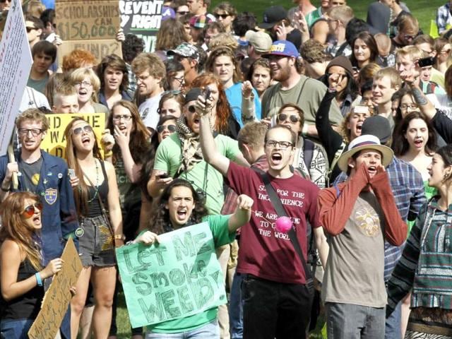 Students and others yell at a pro-marijuana rally at the University of Colorado in Boulder, Colorado. The University of Colorado clamped down on a huge annual marijuana fest on Friday by restricting access to the school and a field where the "smoke-in" is traditionally held, and three protesters were arrested ahead of the event. The event was held on April 20, a date corresponding with a numerical 4/20 code widely known within the cannabis subculture as a symbol for all things marijuana. REUTERS/Rick Wilking