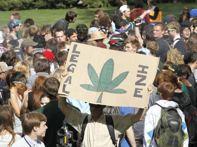 Students and others smoke marijuana at a pro-marijuana rally at the University of Colorado in Boulder, Colorado. The University of Colorado clamped down on a huge annual marijuana fest by restricting access to the school and a field where the "smoke-in" is traditionally held, and three protesters were arrested ahead of the event. The event was held on April 20, a date corresponding with a numerical 4/20 code widely known within the cannabis subculture as a symbol for all things marijuana. REUTERS/Rick Wilking