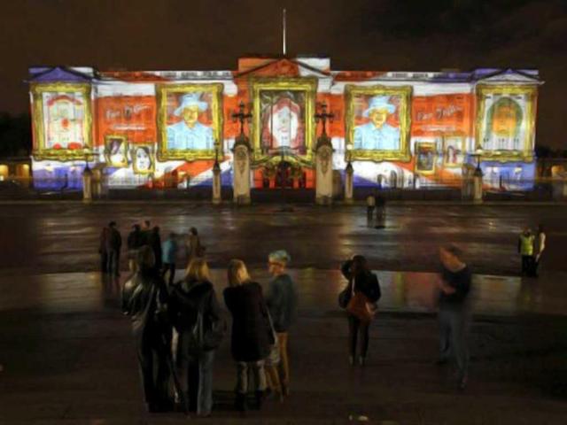 A projection formed of self-portraits of over 200,000 children form a montage image of Queen Elizabeth II on the frontage of Buckingham Palace in London in an event organized by The Prince's Foundation for Children and the Arts. AFP Photo / Justin Tallis
