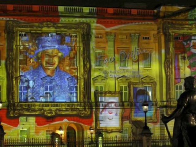 A projection formed of self-portraits of over 200,000 children form a montage image of Queen Elizabeth II on the frontage of Buckingham Palace in London in an event organized by The Prince's Foundation for Children and the Arts. AFP Photo / Justin Tallis