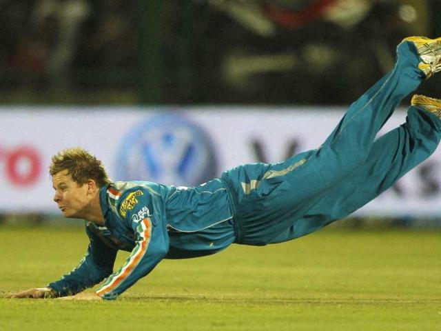 Pune Warriors' Steven Smith dives to stop the ball while fielding against Delhi Daredevils during their IPL-5 match in New Delhi. (PTI Photo/Aman Sharma)