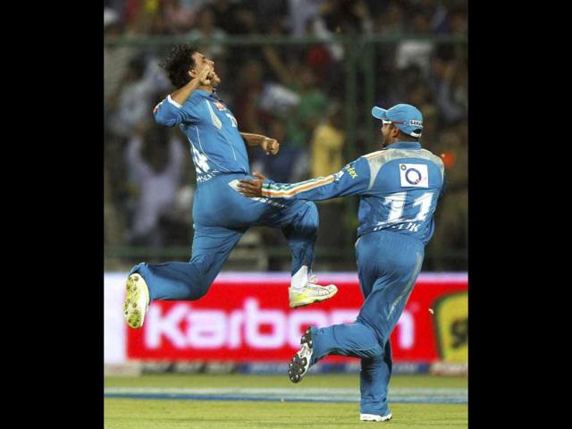 Pune Warriors' Sourav Ganguly celebrates the dismissal of Delhi Daredevils Kevin Pietersen during their IPL-5 match in New Delhi. (PTI Photo/Aman Sharma)