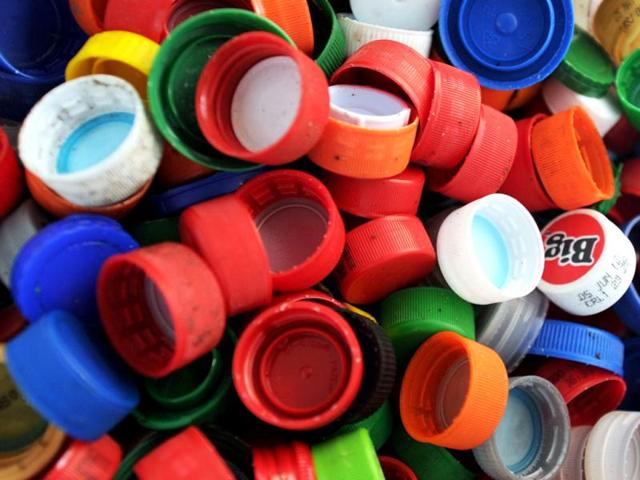 Picture of recyclable plastics screw tops taken at a classification plant in Juan Vinas, on the outskirts of San Jose, Costa Rica. Activists across the globe will celebrate Earth Day on April 22 with events aimed at bringing awareness of environmental concerns. AFP PHOTO/Rodrigo ARANGUA